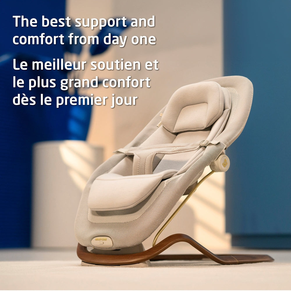 Cream baby bouncer with newborn insert in a lifestyle scene