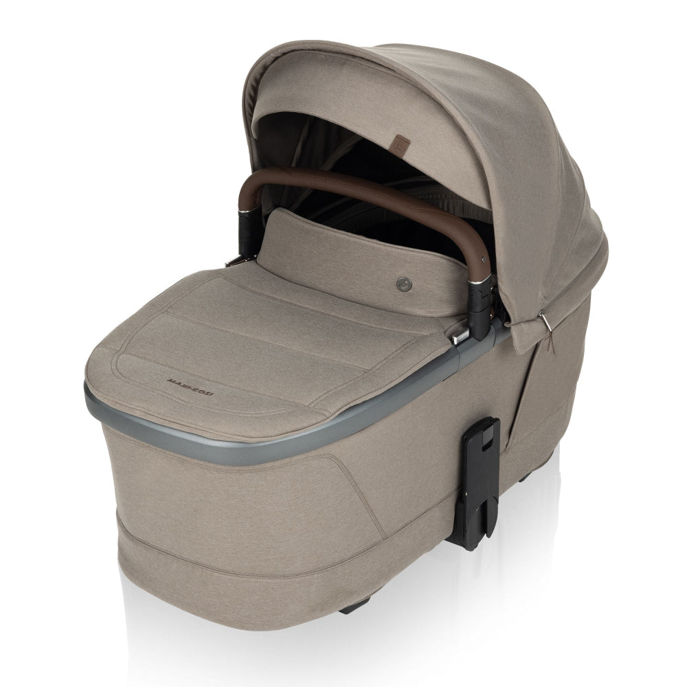 Maxi-Cosi Fame Carry Cot beige bassinet with brown carry handle and canopy