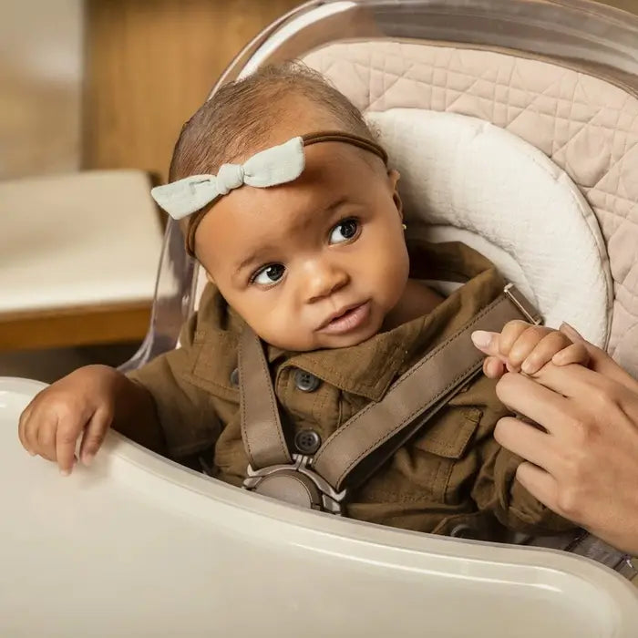 MAXI COSI Kiskadee 360 rotating high chair with beige padded seat and safety harness