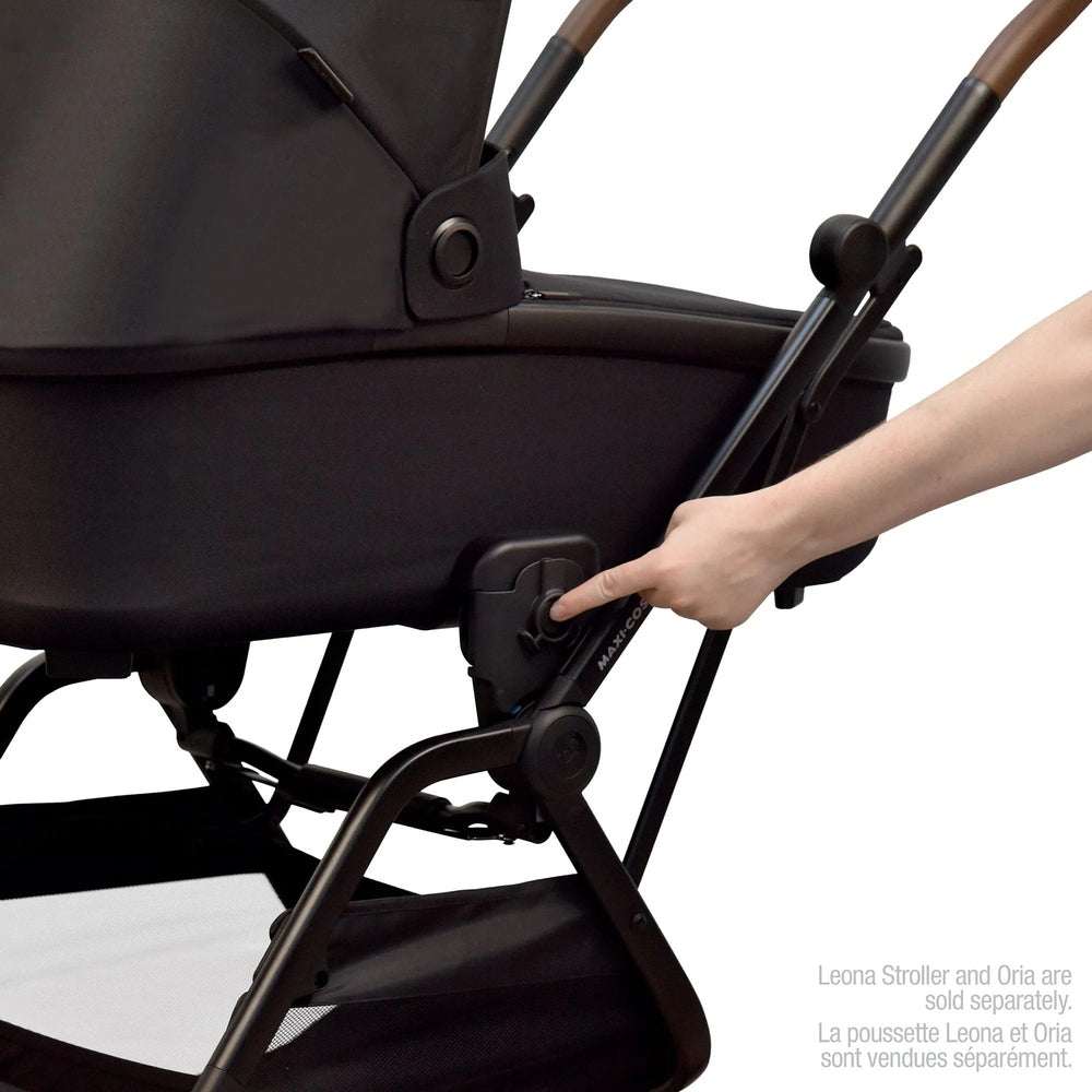 Maxi-Cosi Leona stroller Oria adapters in black on the frame with a hand adjusting the knob