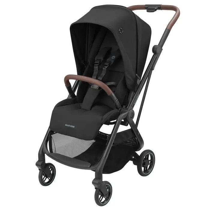 Maxi-Cosi Leona ultra-compact stroller in black fabric with brown leatherette handlebar.