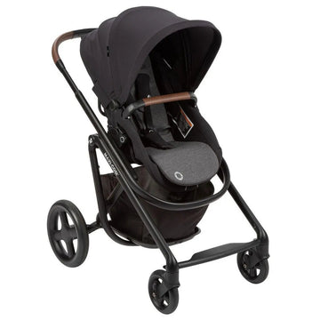 Maxi-Cosi Lila stroller in black with gray seat cushion and brown leatherette handlebar, ready for city stroll.