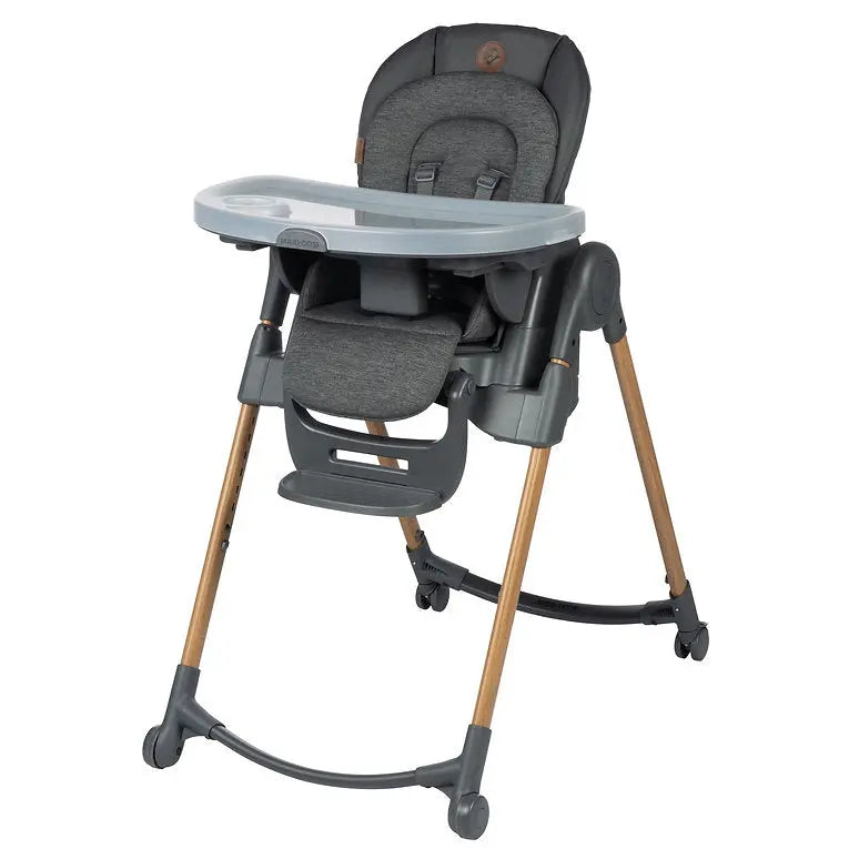Maxi Cosi Minla 6-in-1 High Chair with gray fabric seat, detachable tray, and wooden legs.