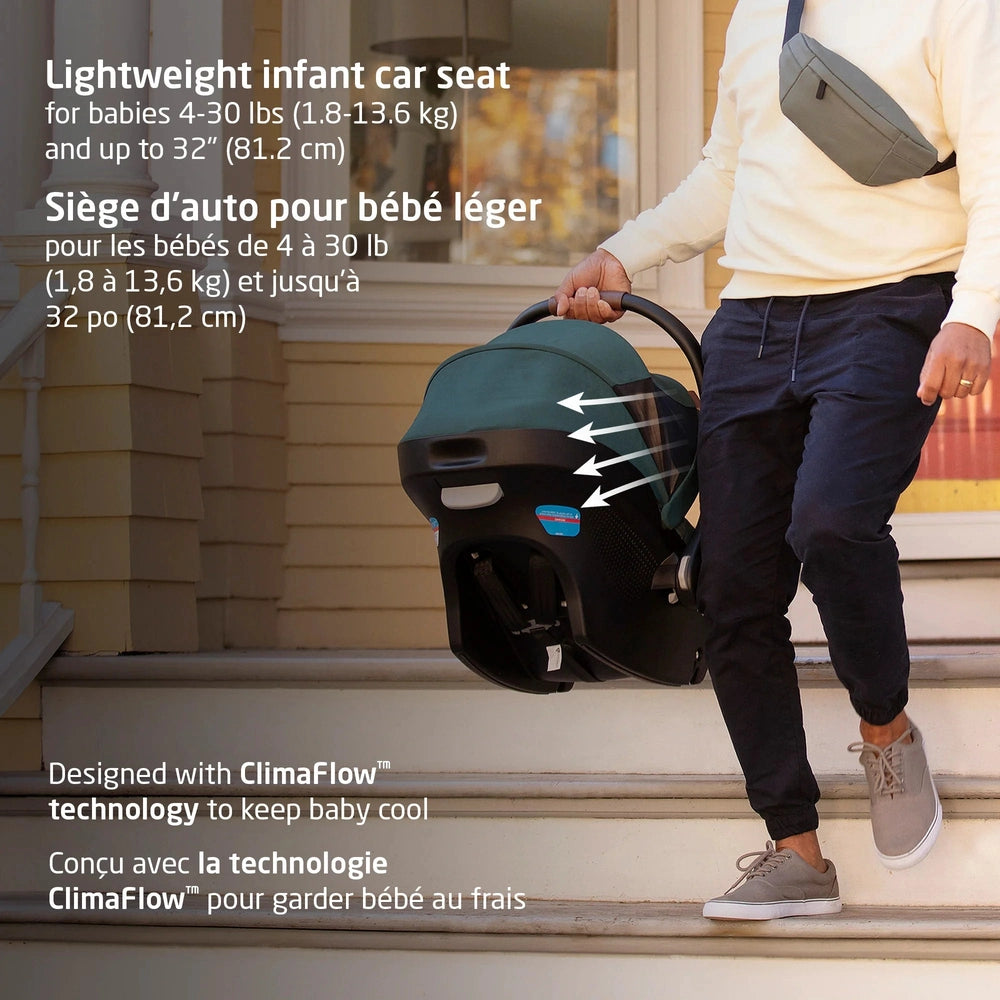 MAXI COSI Oxford Travel System + Oria Bassinet; lightweight infant car seat being carried down stairs by a person.