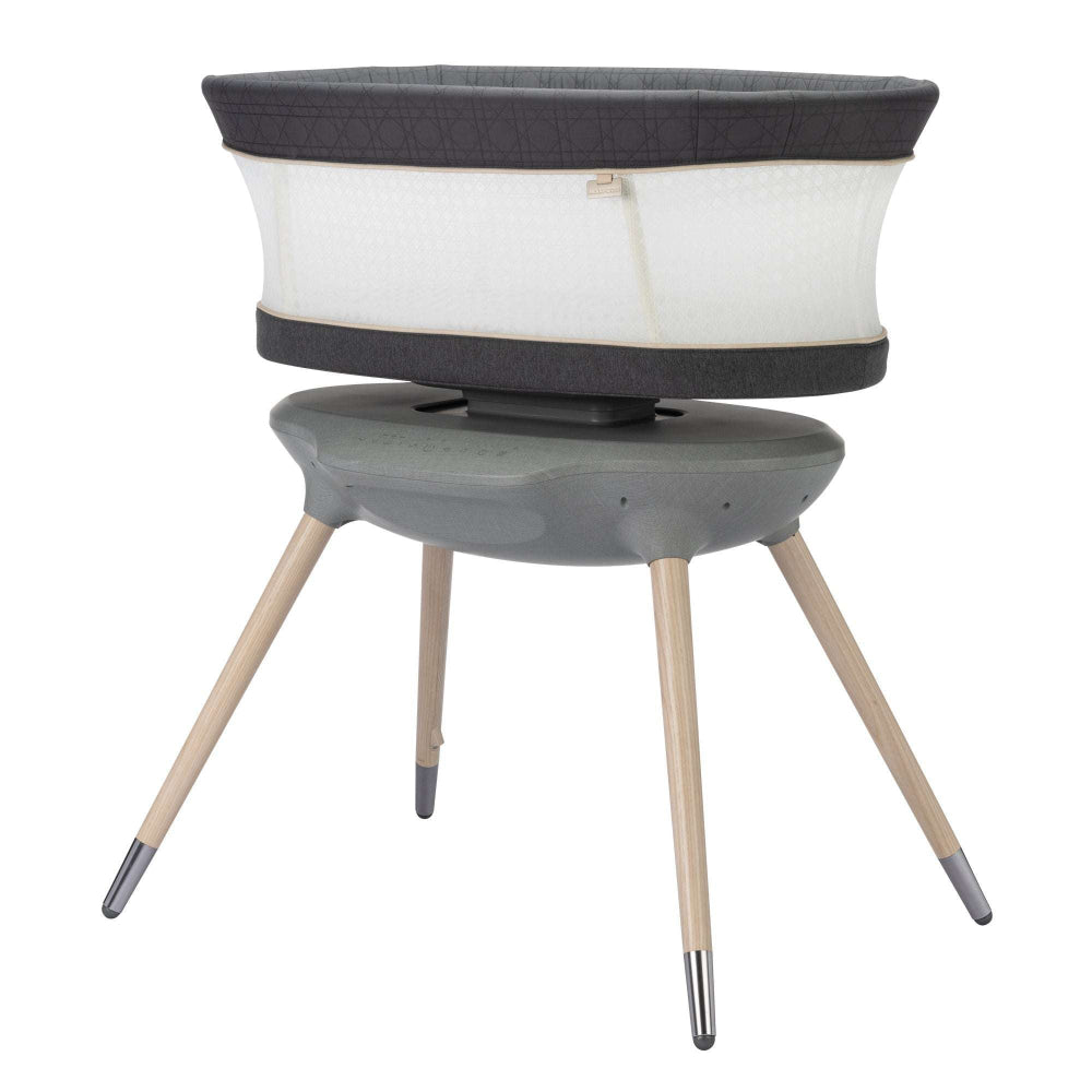 Maxi-Cosi Starling Smart Bassinet with gray fabric and natural wood legs