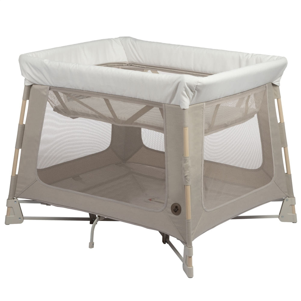 MAXI COSI Swift Playard bassinet in beige with white padded bumper and mesh walls