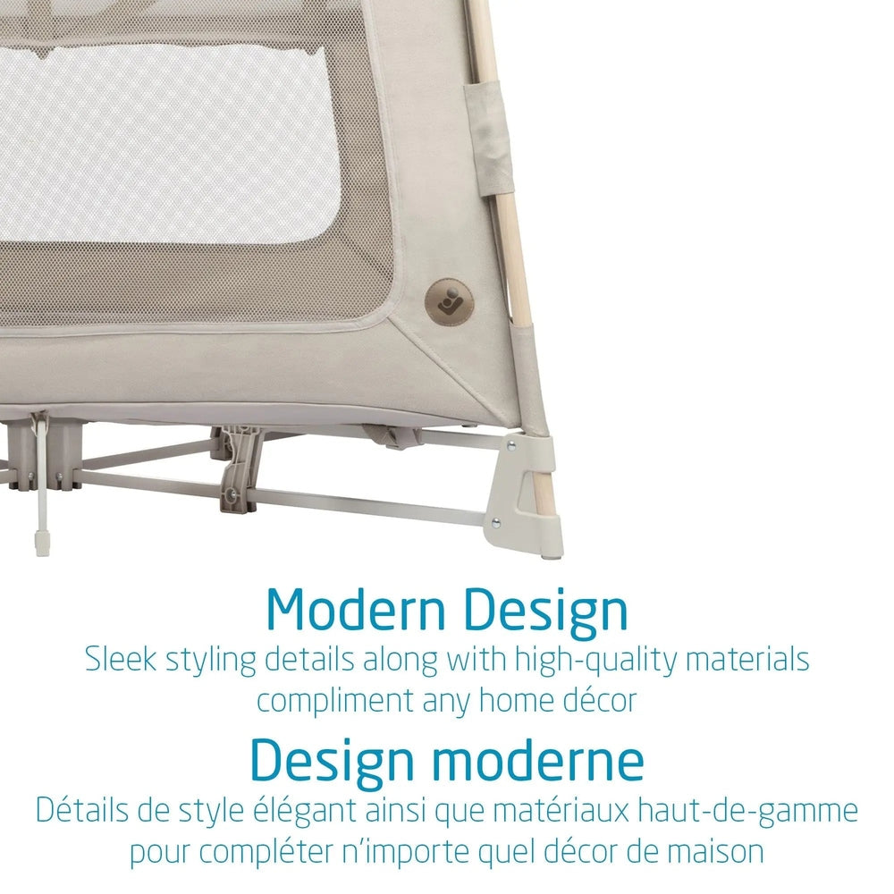 Maxi Cosi Swift Playard beige with mesh window and metal frame, shown fully assembled for use.