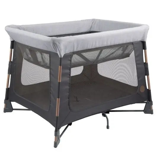 Maxi Cosi Swift Playard, gray with mesh sides and wooden accents, shown standing with a sturdy base and breathable panels.