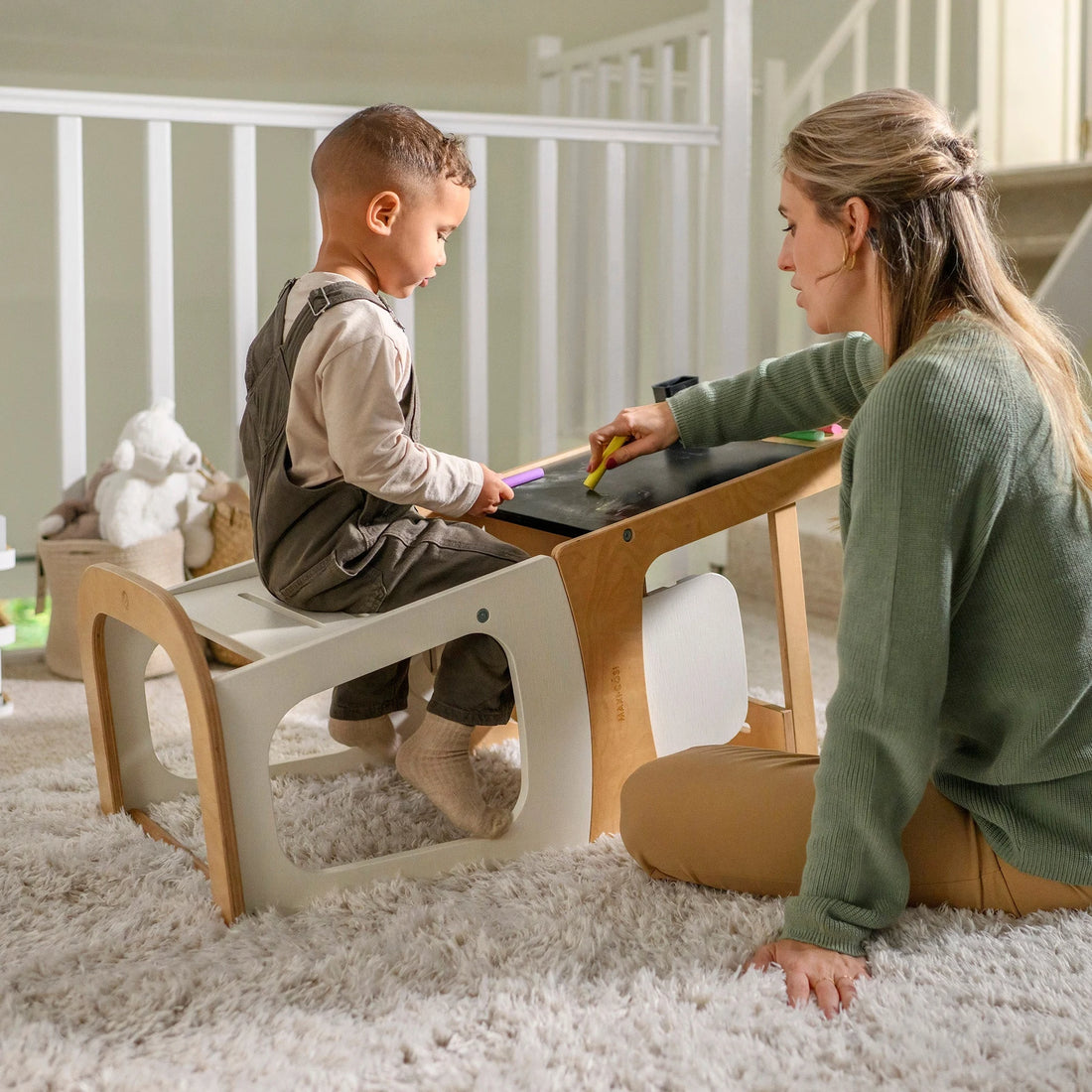 Maxi-Cosi Toucan 3-In-1 Tower- Natural White — caregiver and child using the blackboard table