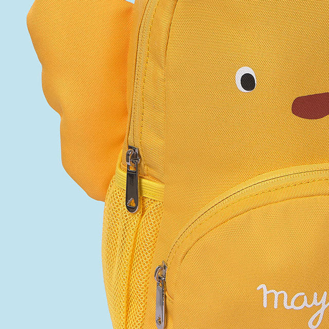 Yellow backpack shaped like a fish with 'may' embroidered on it against a light blue background