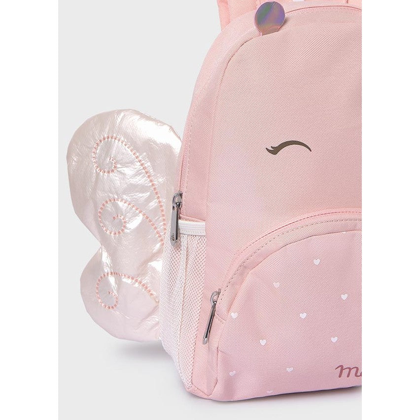 Pink backpack with heart patterns on a light gray background
