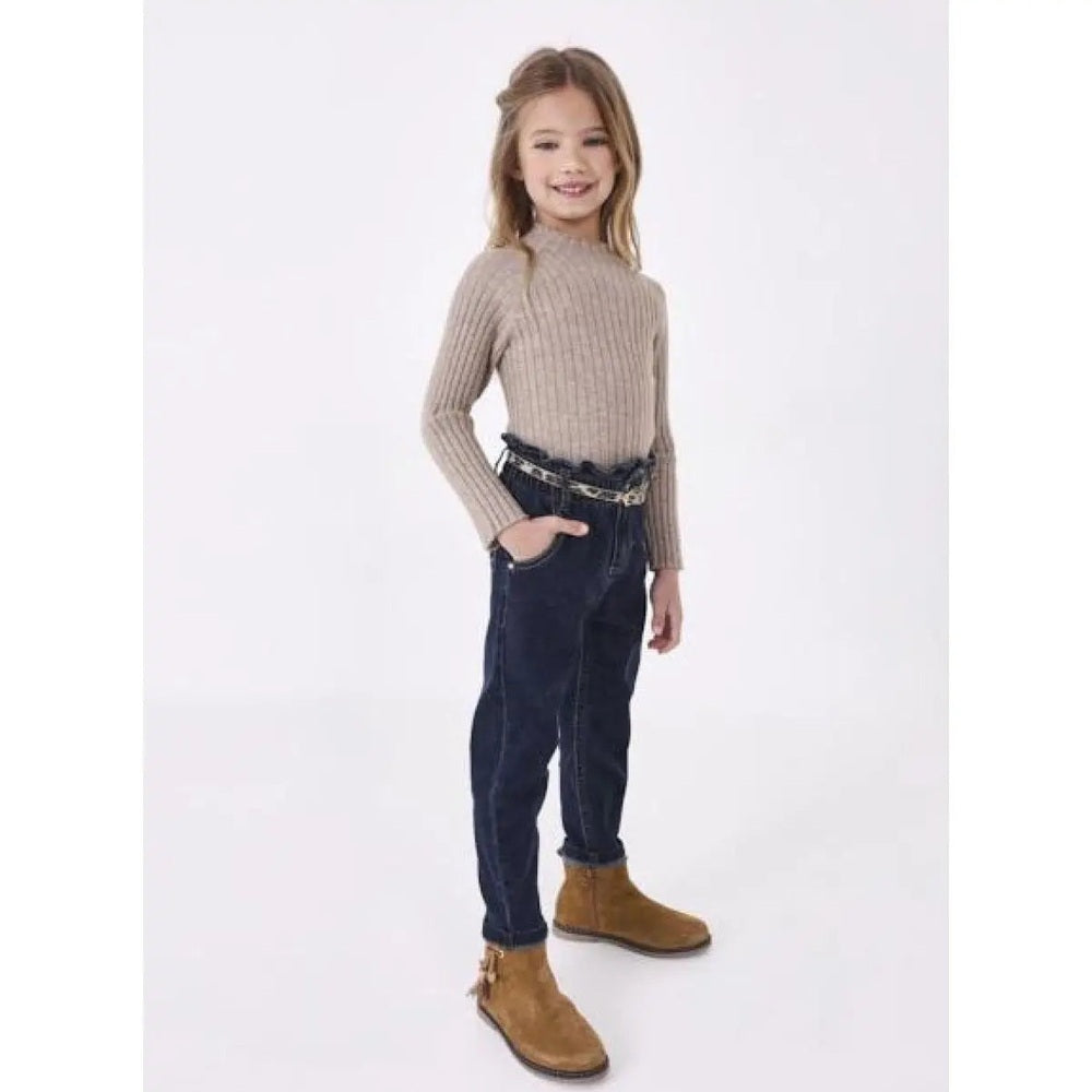 Mayoral Girls Denim Pants With Belt: girl in dark blue denim with beige belt, standing with hands in pockets.