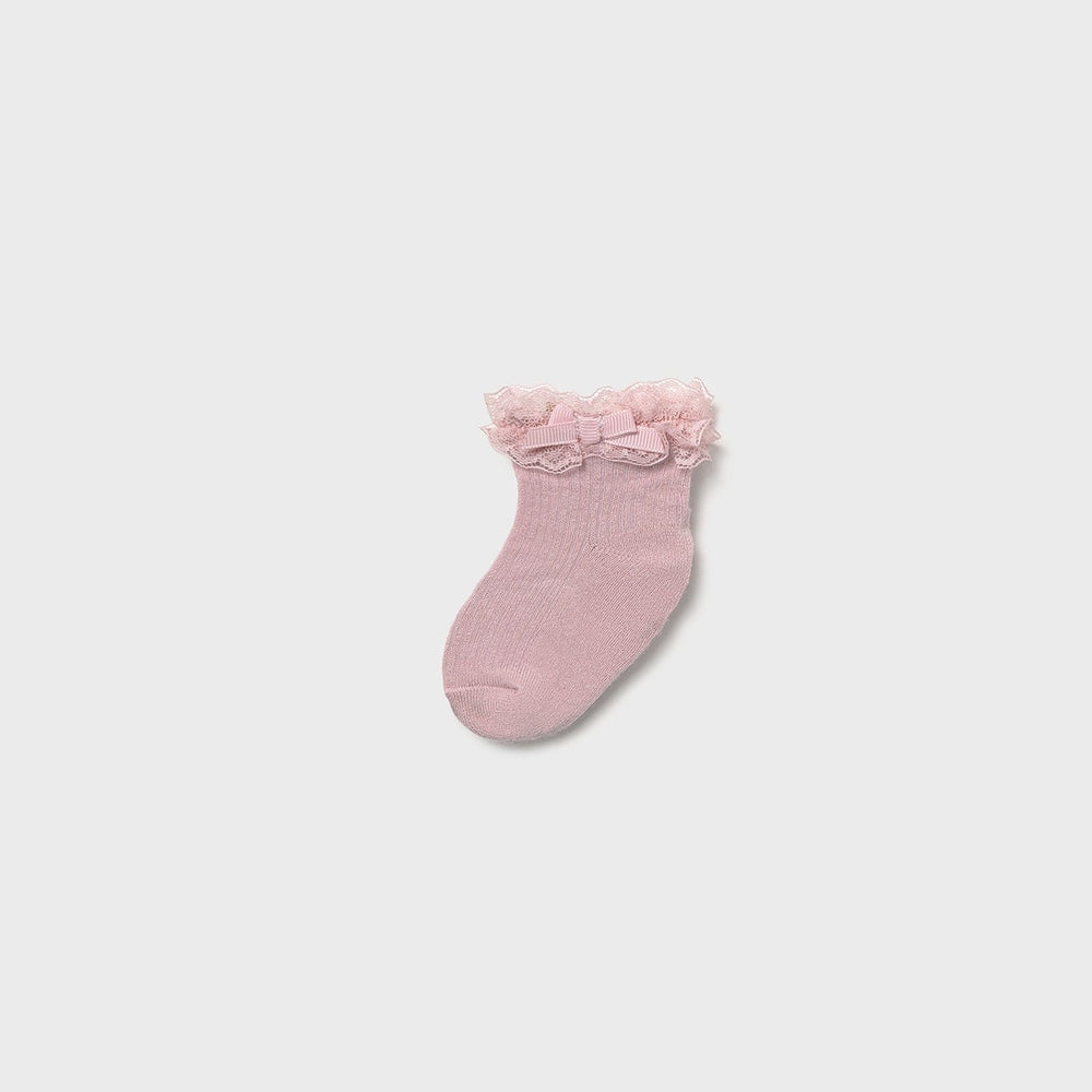 Mayoral Newborn Dress Socks Baby Rose Pink; rose-pink sock with lace ruffle and bow, shown laid flat.