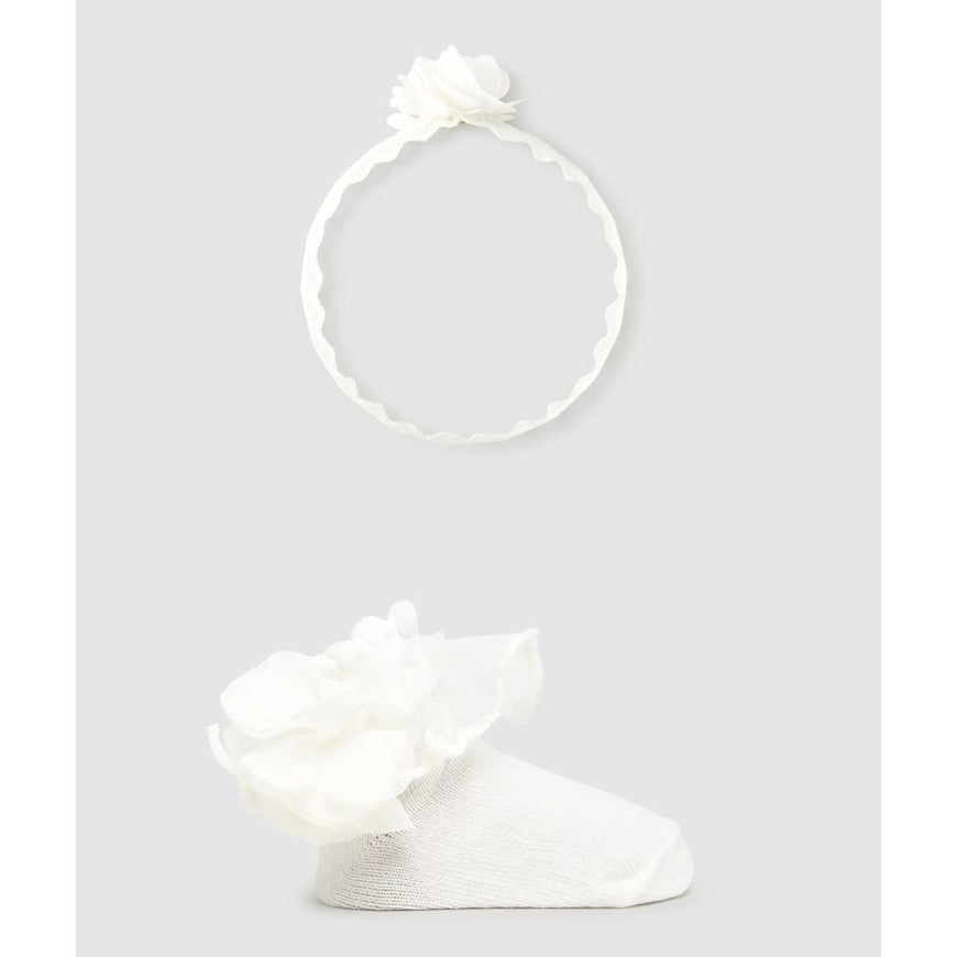 MAYORAL newborn headband and socks set in natural white, featuring a flower-adorned headband and a matching flower-attached sock.