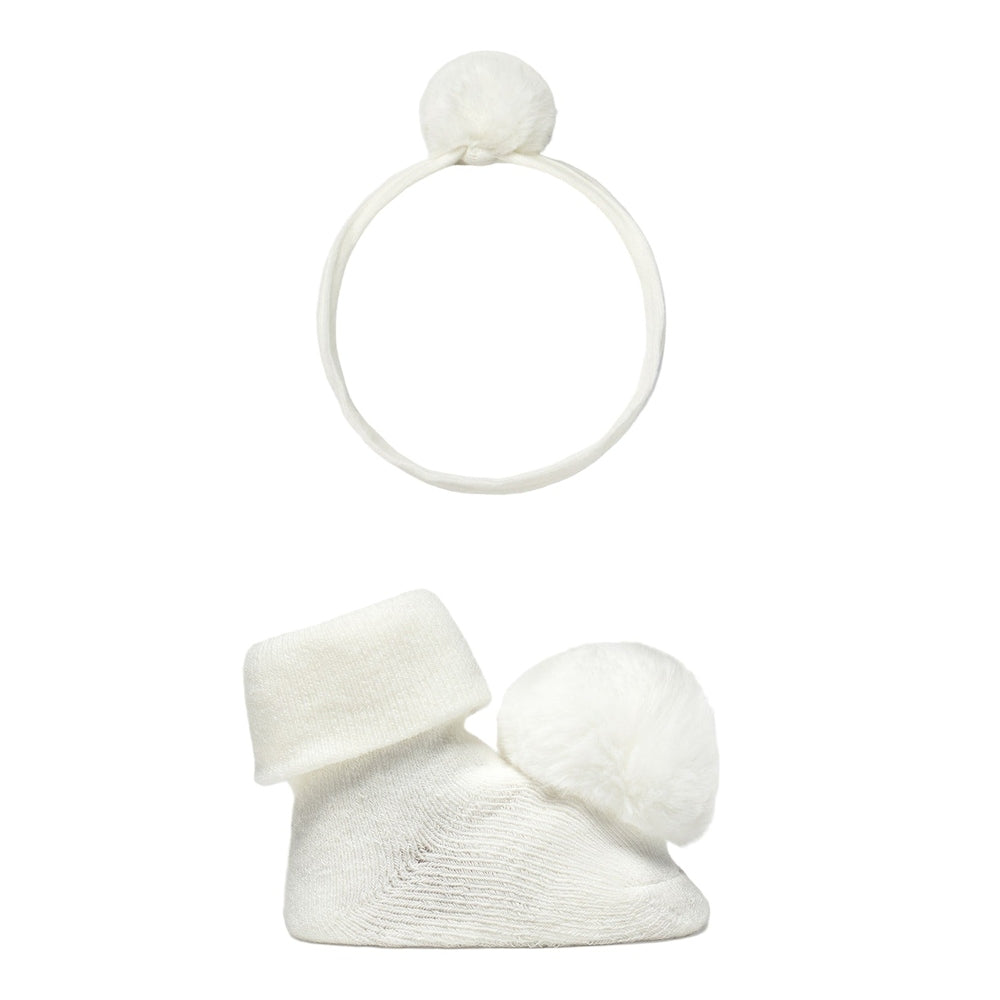 Mayoral newborn headpiece and socks set natural, white knit two-piece with fluffy pompom on headband and sock.