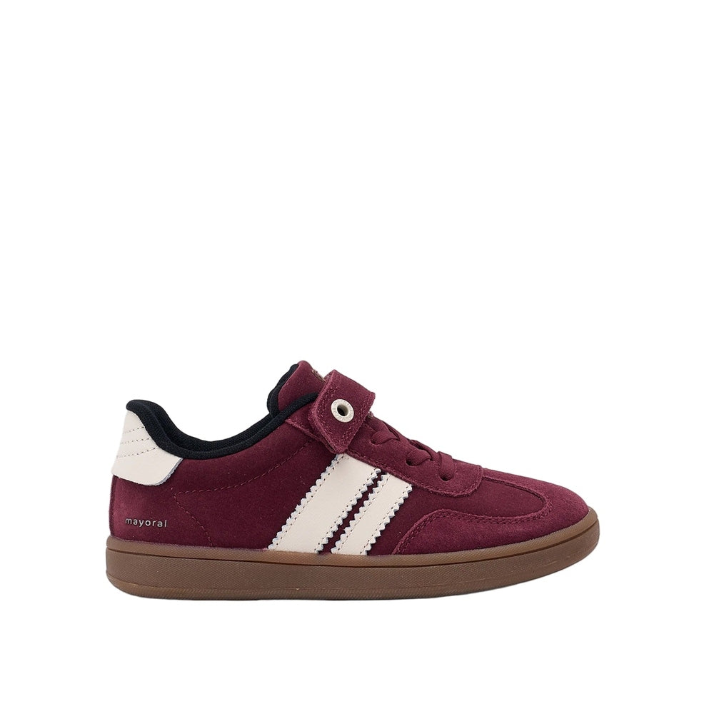 Mayoral Trainers Bordeaux toddler shoe with burgundy suede, white stripes, and gum sole, featuring a Velcro strap and laces.