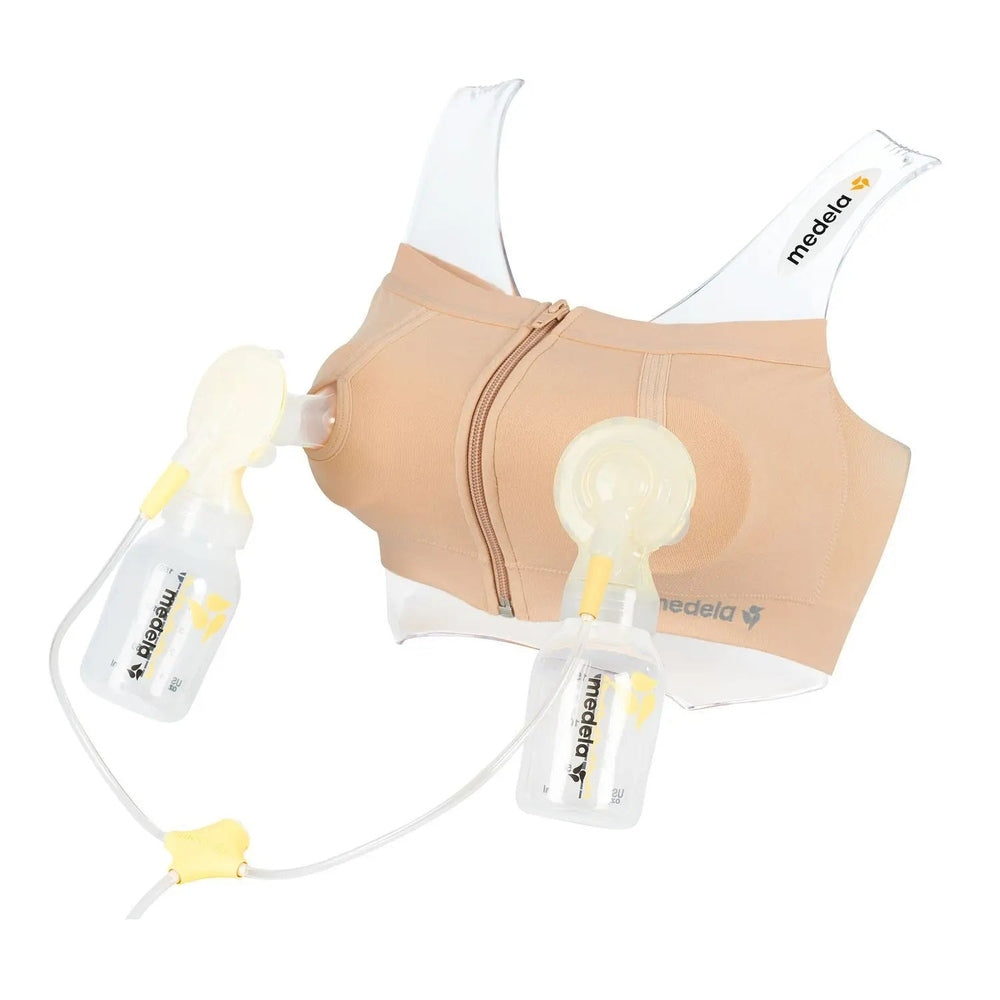 Medela Easy Expression Bustier Nude nursing bra shown with dual pumps attached to milk bottles and tubing.
