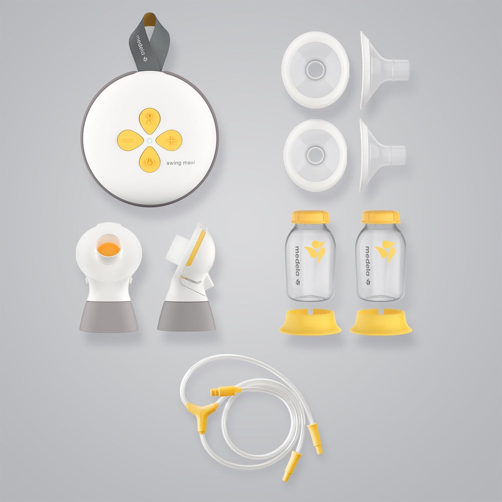Medela Swing Maxi double electric breast pump kit with two bottles, shields, membranes, tubing and yellow lids