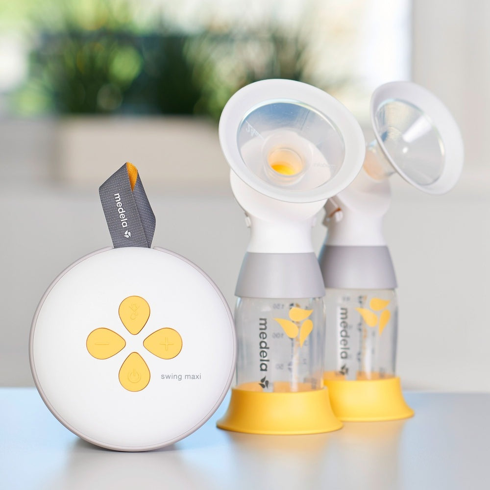 Medela Swing Maxi double electric breast pump with two bottles and yellow bases