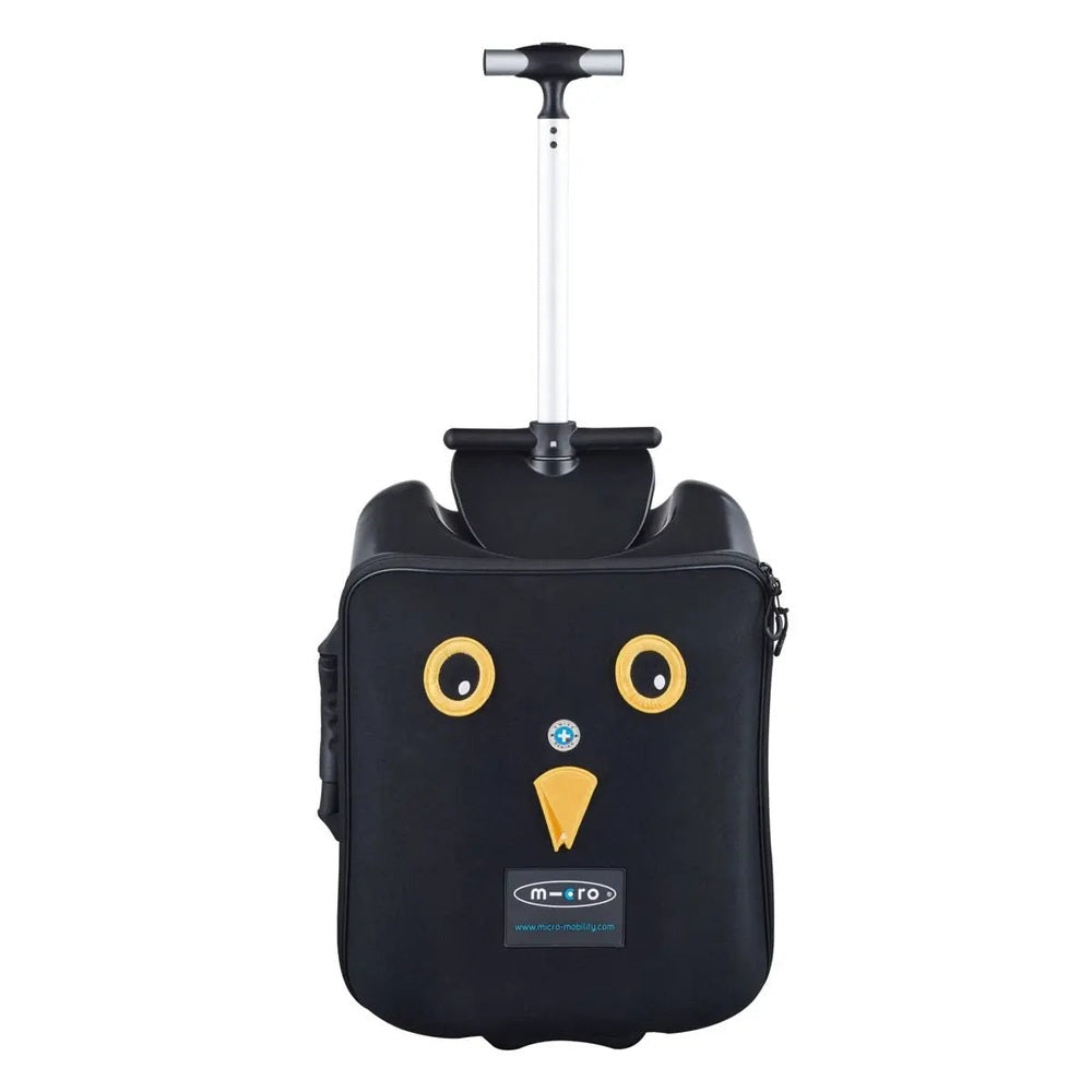 Micro Eazy Luggage black suitcase with yellow owl eyes and beak, extendable telescoping handle visible.