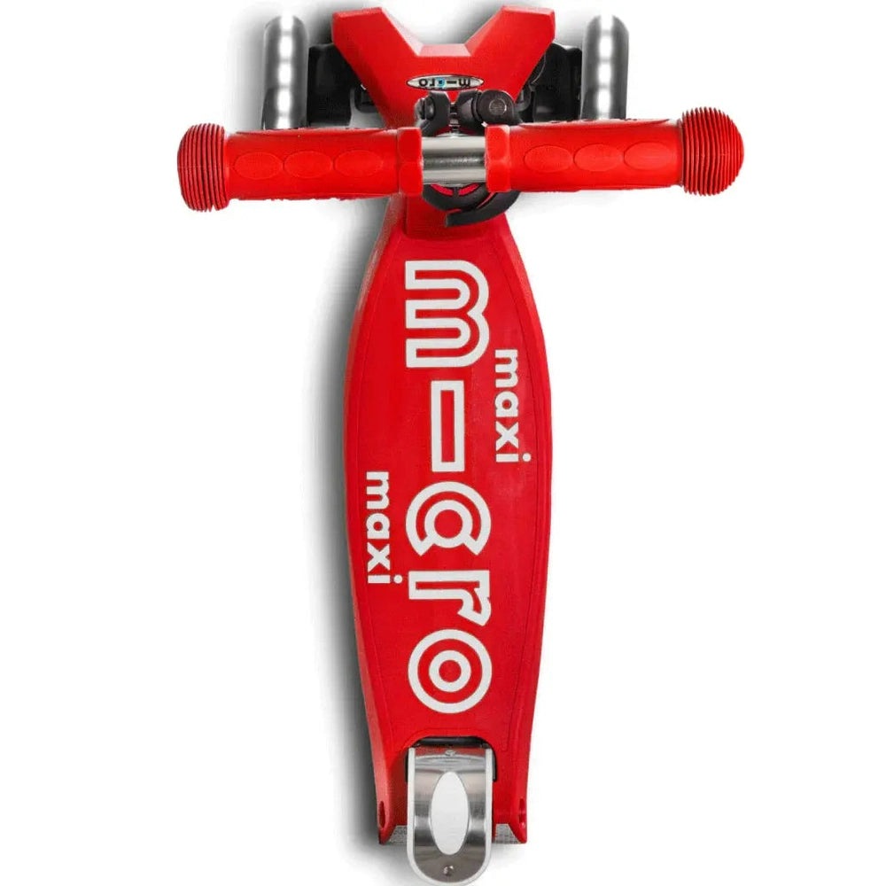Micro Maxi Foldable Deluxe LED Scooter red with white MICRO branding, handlebars ready for riding on deck view.