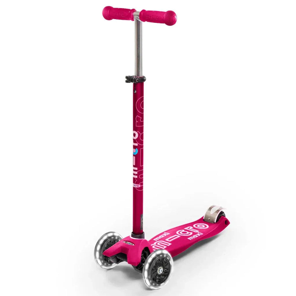 MICRO Micro Maxi Deluxe Led Scooter pink three-wheel scooter with LED deck accents and taller handlebar for bigger kids