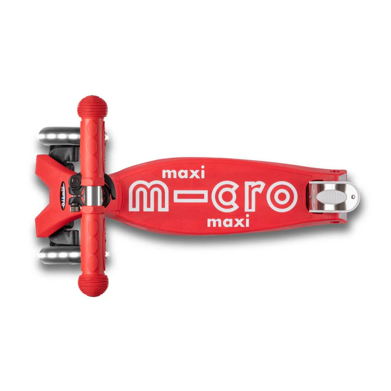 Micro Maxi Deluxe LED scooter for kids, red deck with MICRO branding and wheels visible, ready to ride