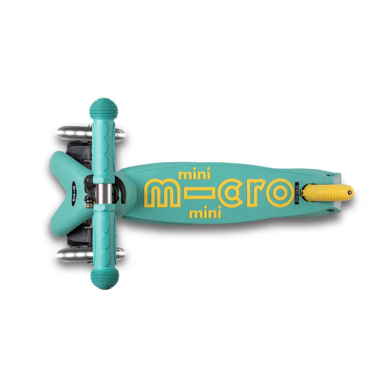 Micro Mini Deluxe Eco Scooter Green turquoise deck with bold yellow MICRO logo for outdoor riding