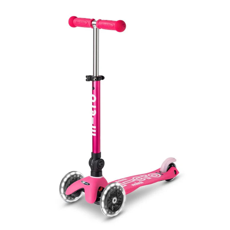 Micro Mini Deluxe Foldable LED Scooter pink three-wheel design with LED lights, ready to ride.