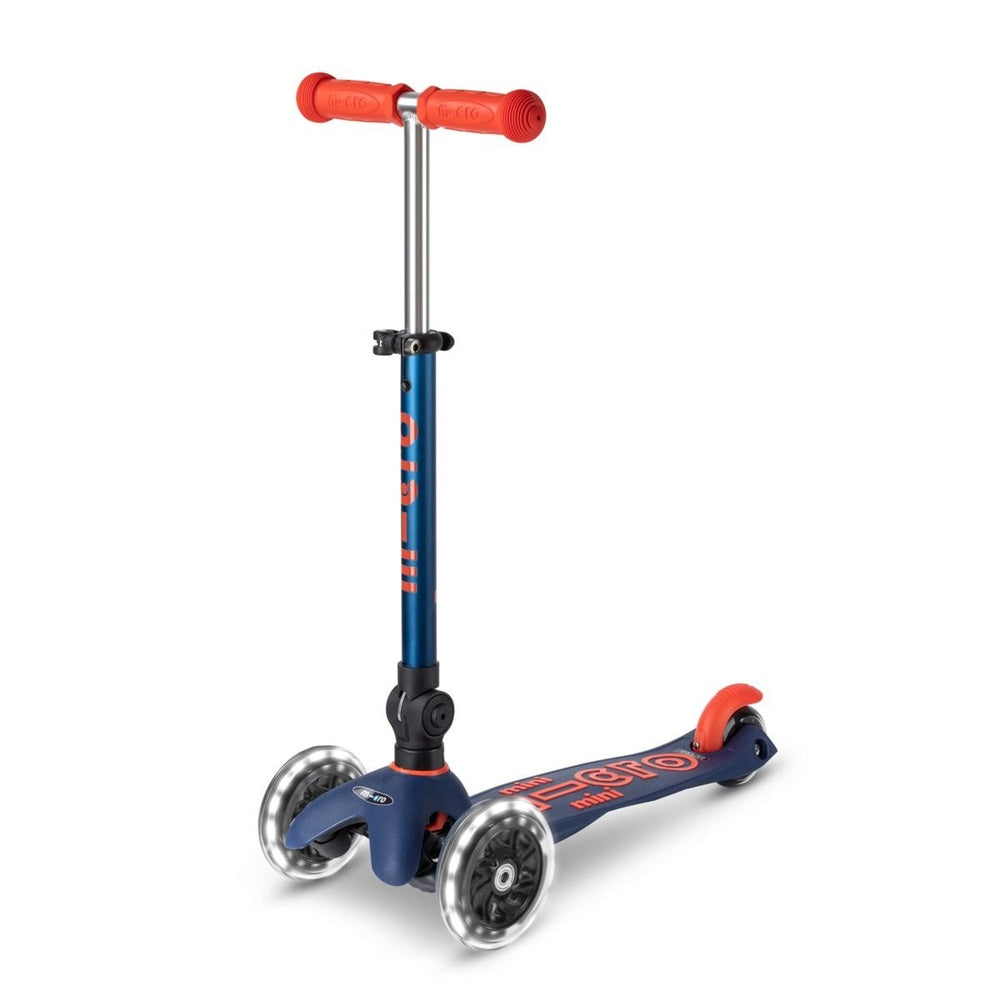 Micro Mini Deluxe Foldable LED Scooter for kids, blue with orange accents, three-wheel stability ready to ride