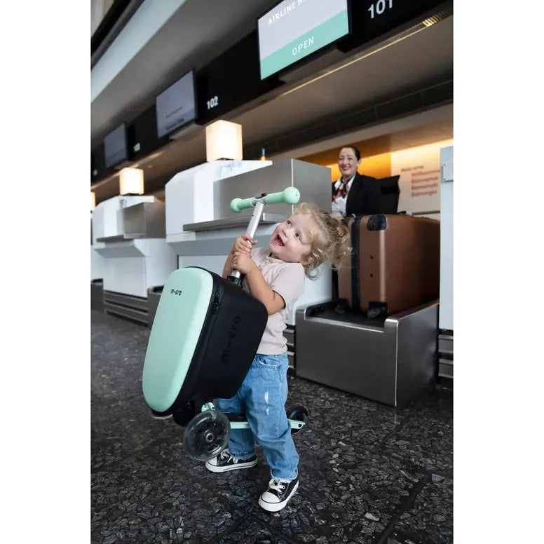 Micro Scooter Junior Luggage Mint, mint kid luggage scooter; child rides it through the airport.