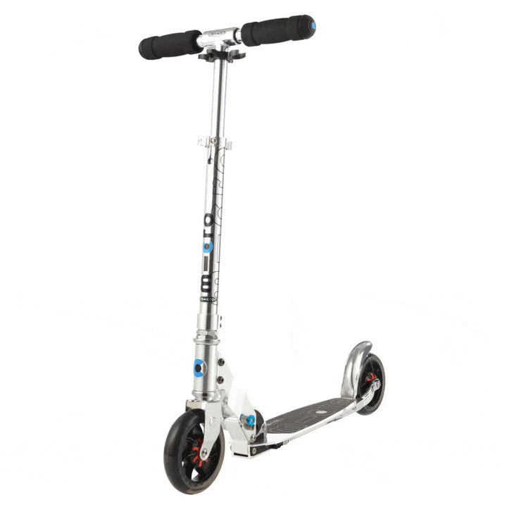 Micro Speed Scooter Pure Silver by MICRO with aluminum frame, black grip handlebars, and two wheels.