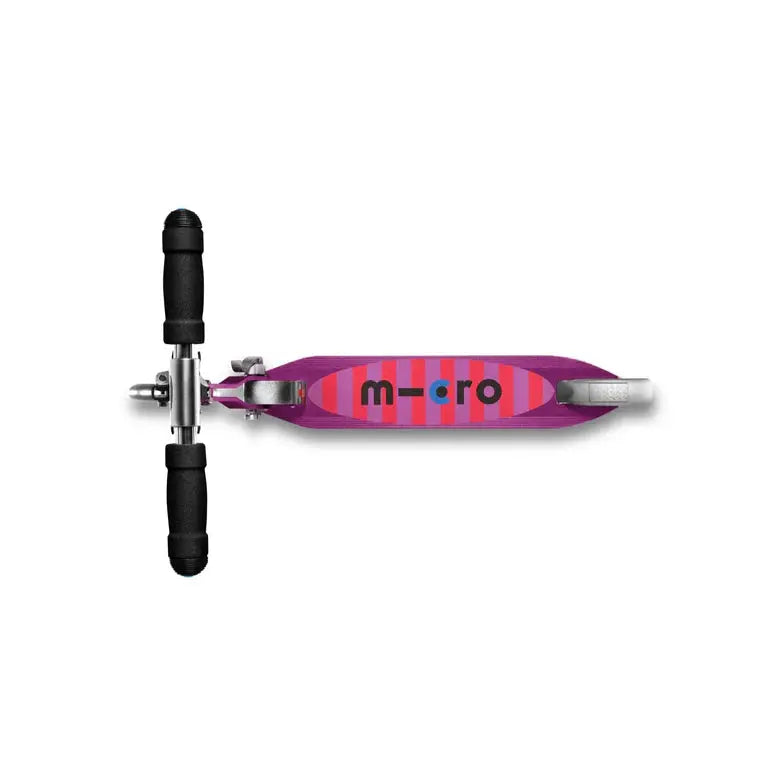 Micro Sprite LED Scooter; purple-pink striped deck with black grip handles viewed from top.