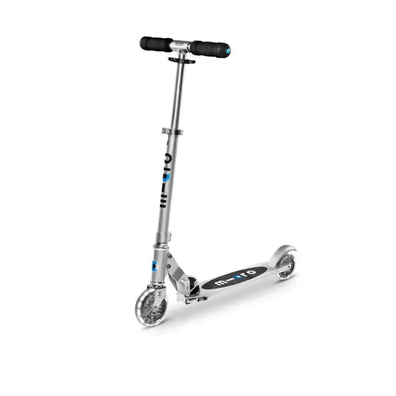 Micro Sprite LED Scooter, silver frame with blue accents, handlebars gripped and deck ready to ride.