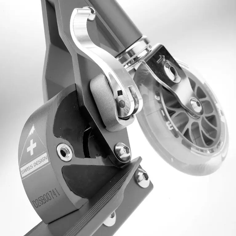 Micro Sprite Scooter close-up of front wheel and braking mechanism, showcasing precise MICRO Swiss design.