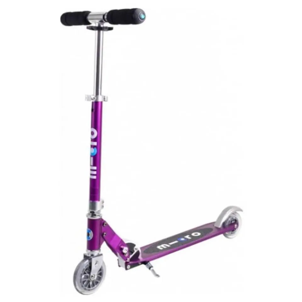 Micro Sprite scooter in purple with silver handlebar and brake, MICRO deck logo visible.