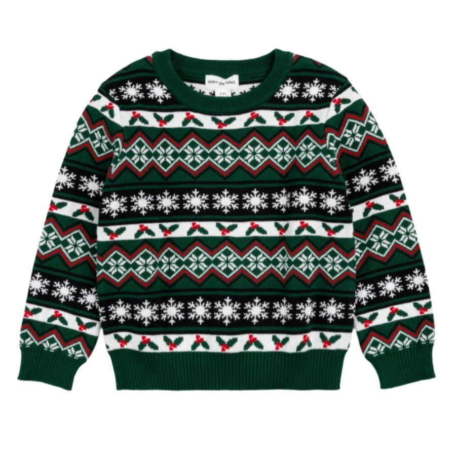 Miles The Label Cool Yule Fair Isle Jacquard Sweater laid flat, emerald green knit with red/white snowflake patterns and ribbed cuffs.