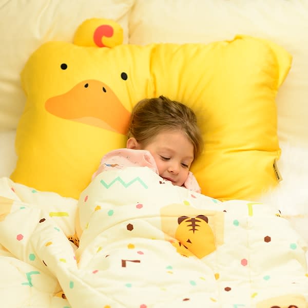 MILO & GABBY kids pillowcase with pastel confetti pattern and yellow duck backdrop