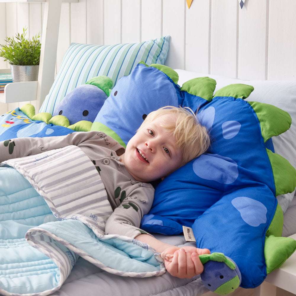 Milo & Gabby kids pillowcase set with blue dinosaur print and green accents on striped bedding