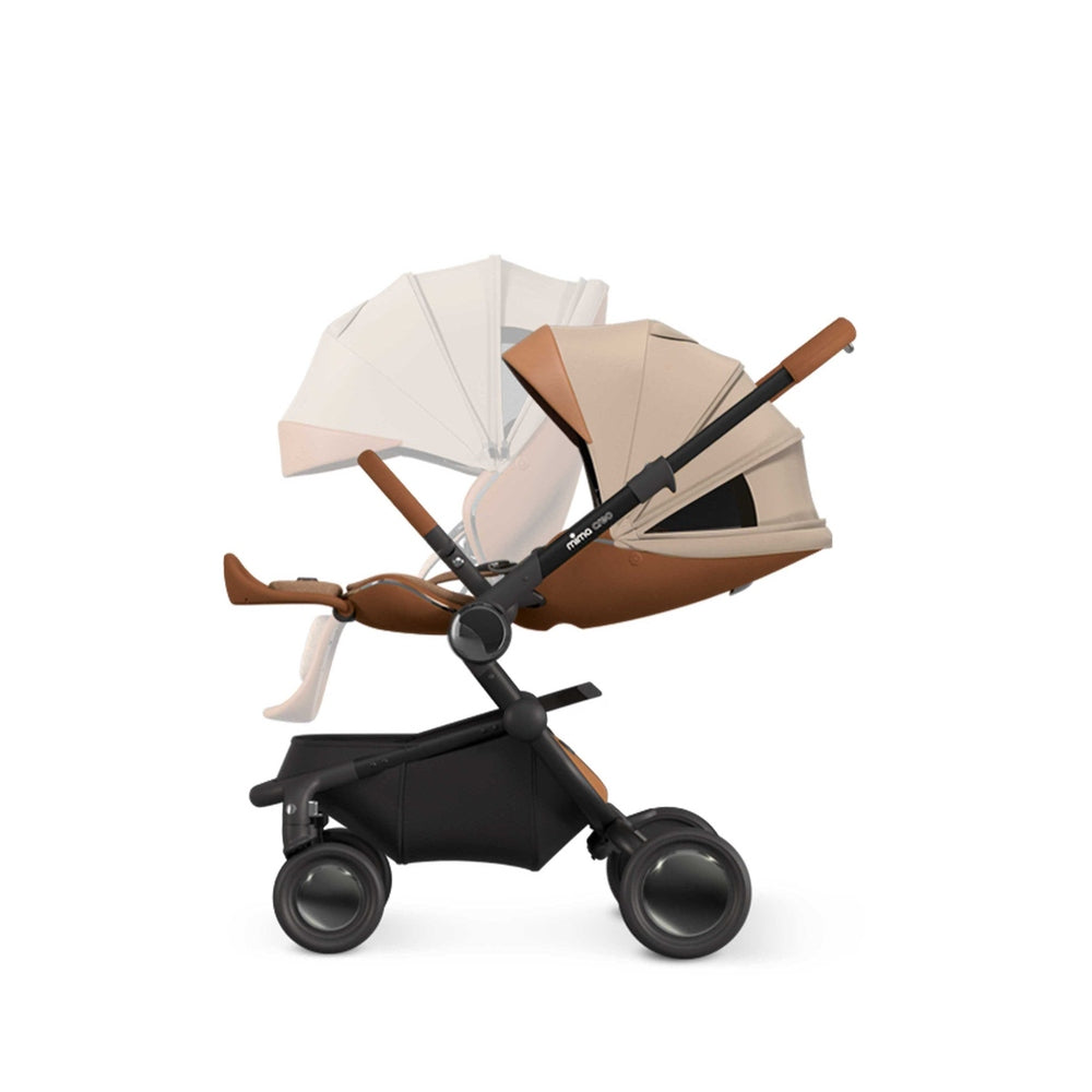 Mima Creo Stroller in beige/tan with black frame and large wheels, shown ready for a smooth stroll.