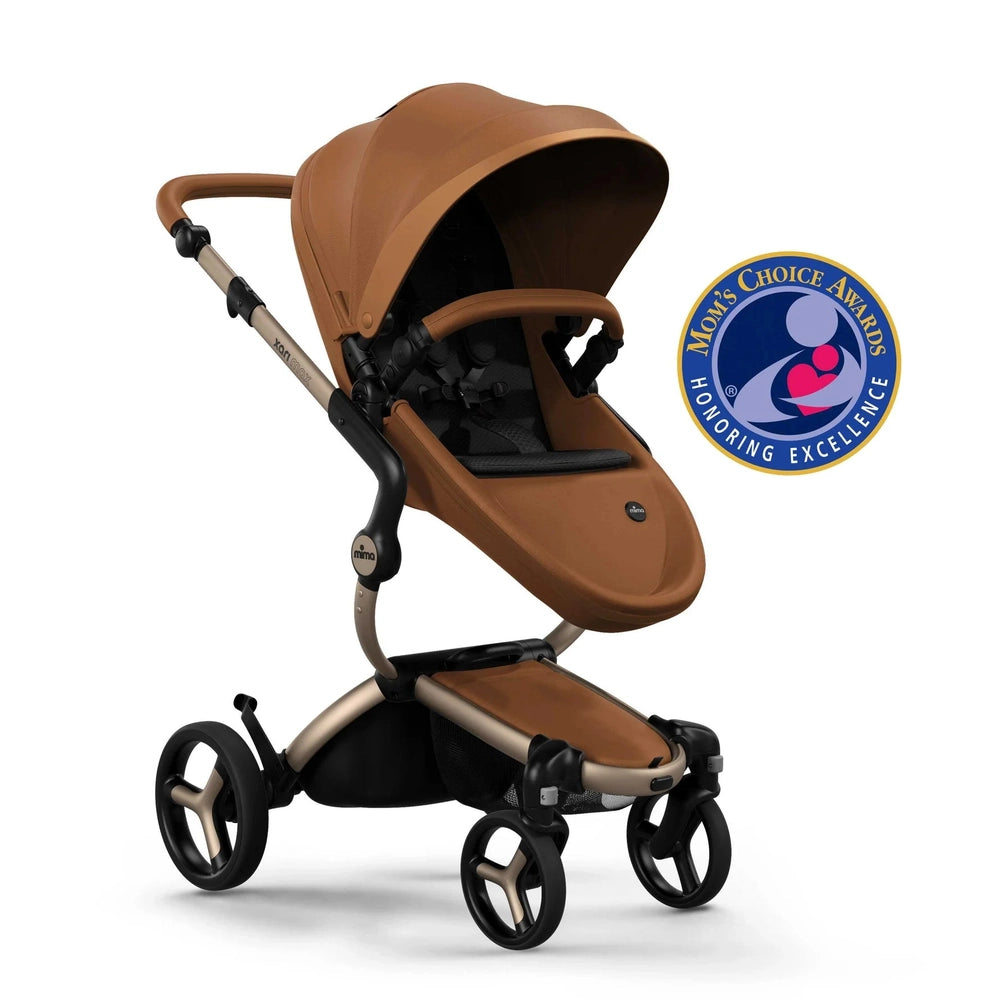 Mima Xari Max Stroller in brown with tan frame, canopy extended over seat on a sleek 4-wheel chassis.