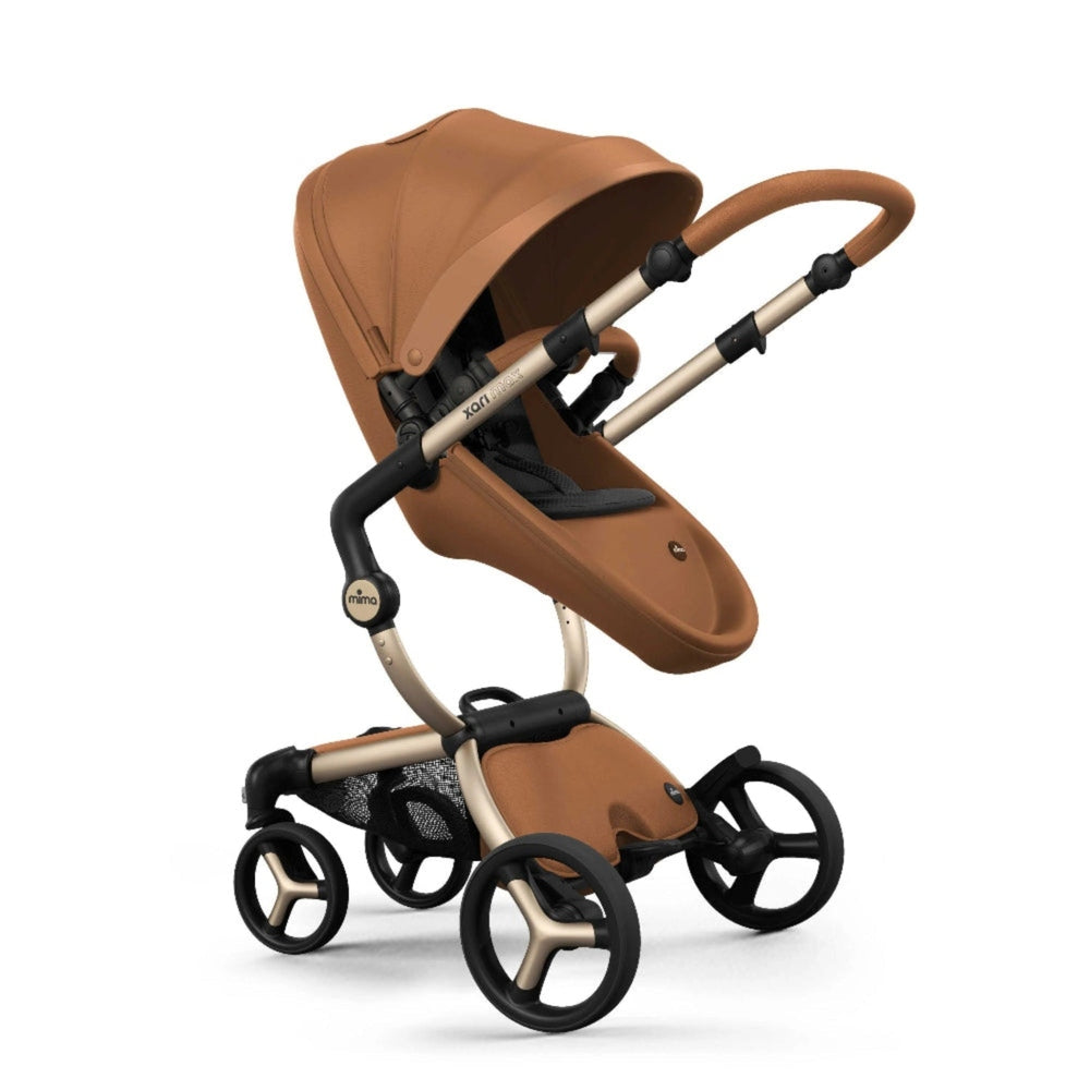 Mima Xari Max Stroller in caramel brown with bronze frame and large canopy, four-wheel chassis built for easy stroll.