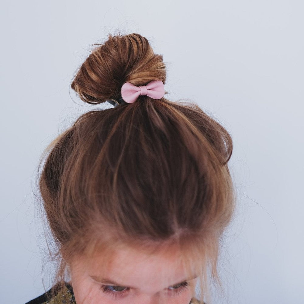 Mimi & Lula Gracie Ponies Pink hair tie with pale pink bow in a child's bun
