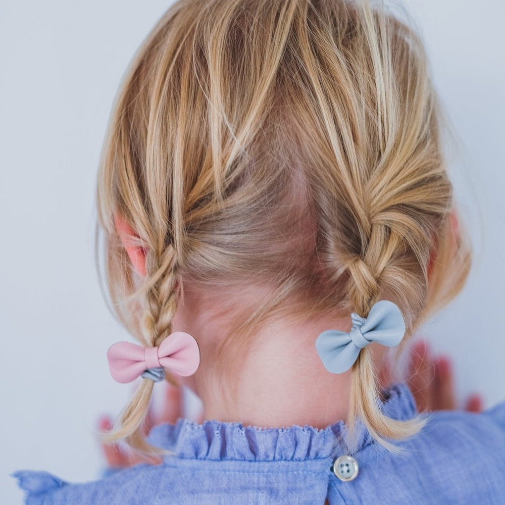 Mimi & Lula Gracie Ponies Pink hair ties on twin braids with pastel pink and blue bows