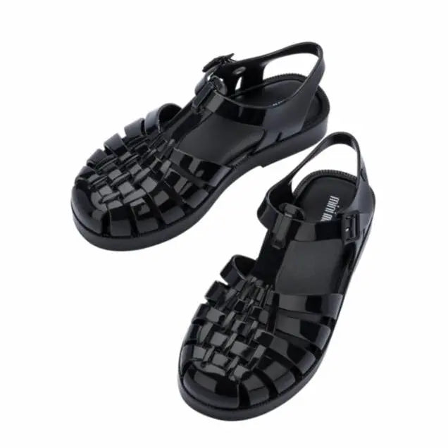 Mini Melissa Child Possession Sandal in black jelly with woven front straps, a pair for kids.