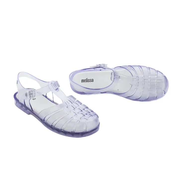 Mini Melissa Child Possession Sandal Clear Glass translucent jelly sandals with purple-tinted sole, shown as a pair.
