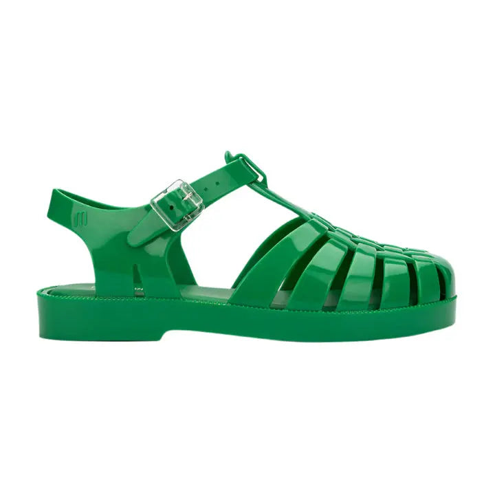 Mini Melissa Possession Sandal Green, green jelly sandal with adjustable buckle strap securely fastened on the foot.