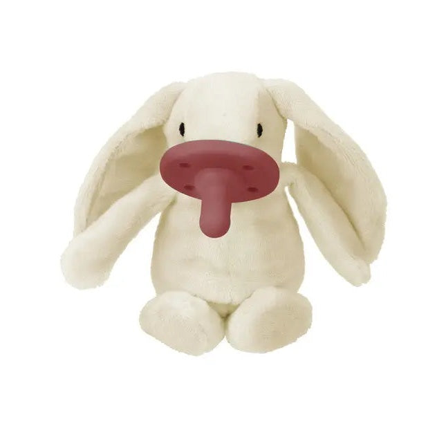 Minikoioi Sleep Buddy plush bunny with pink pacifier nose on cream fabric, soothing baby toy