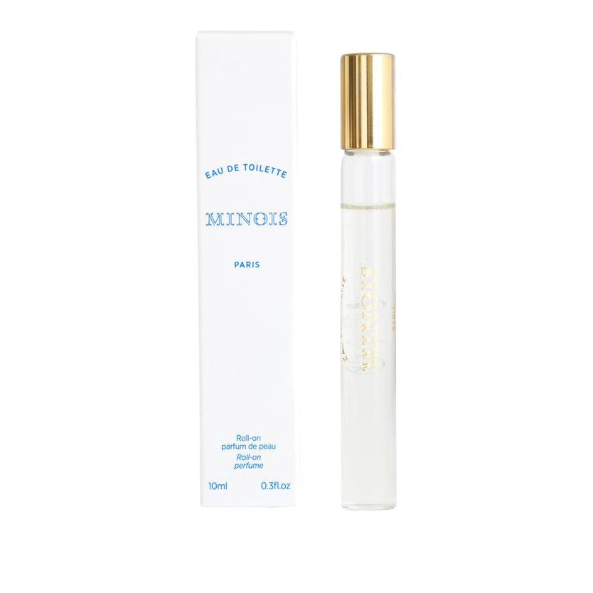 Minois Paris Eau de Toilette Roll-On 10 ml, clear bottle with gold cap beside white box