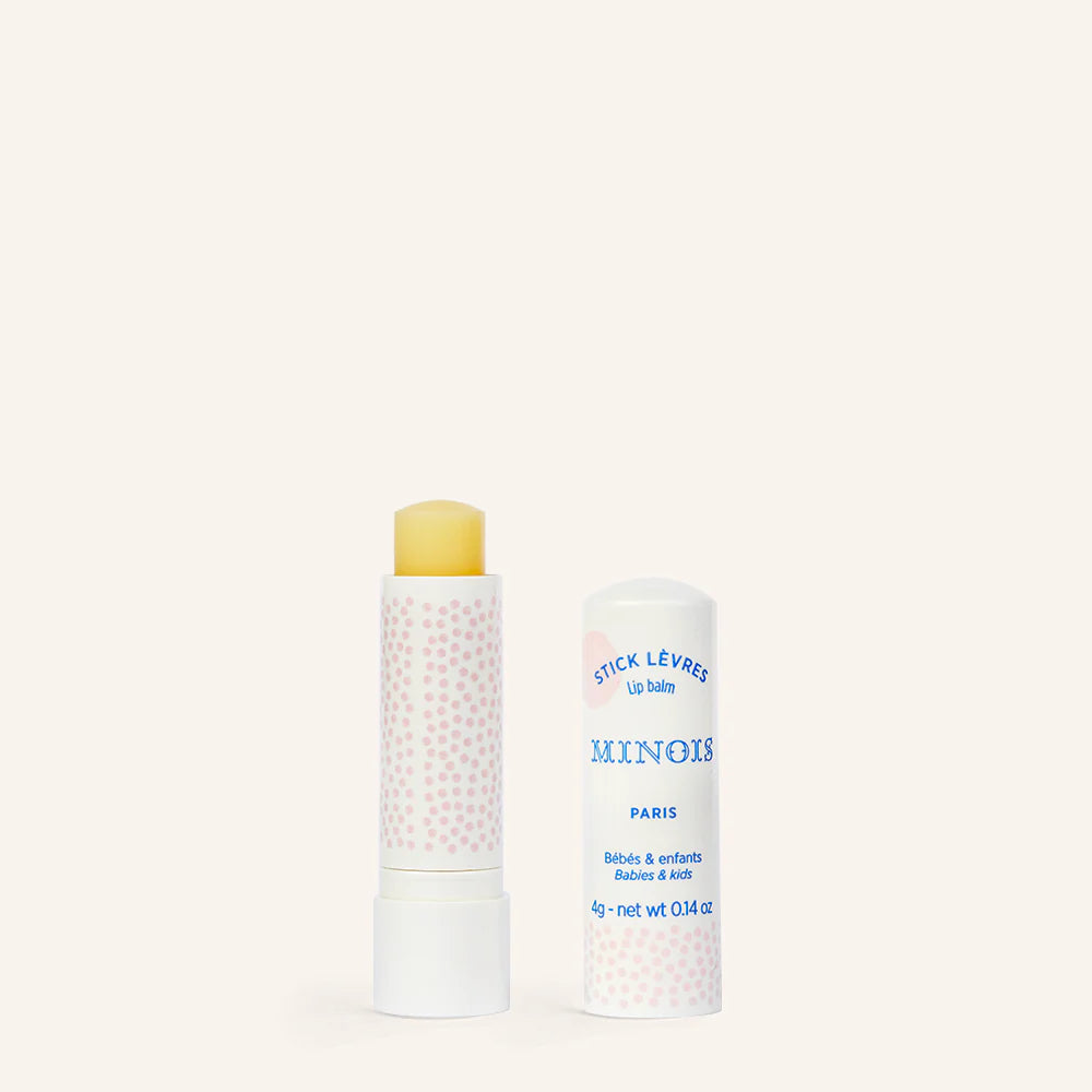Minois Paris lip balm stick; white tube with pink polka dots and yellow balm